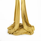 Gold yoga hammock piled up