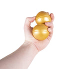 2 gold balls in hand
