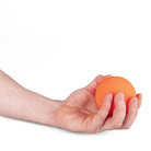 Single orange Mr Babache russian juggling ball in hand