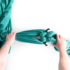 Sling rigged to figure 8 in hand being tightened