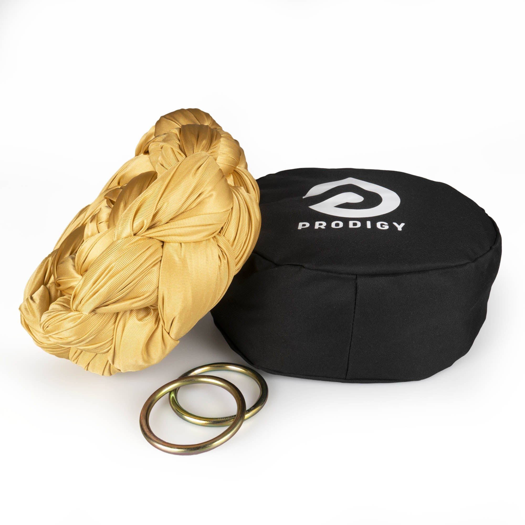 Prodigy 6m gold aerial yoga hammock resting on hammock bag with the rings