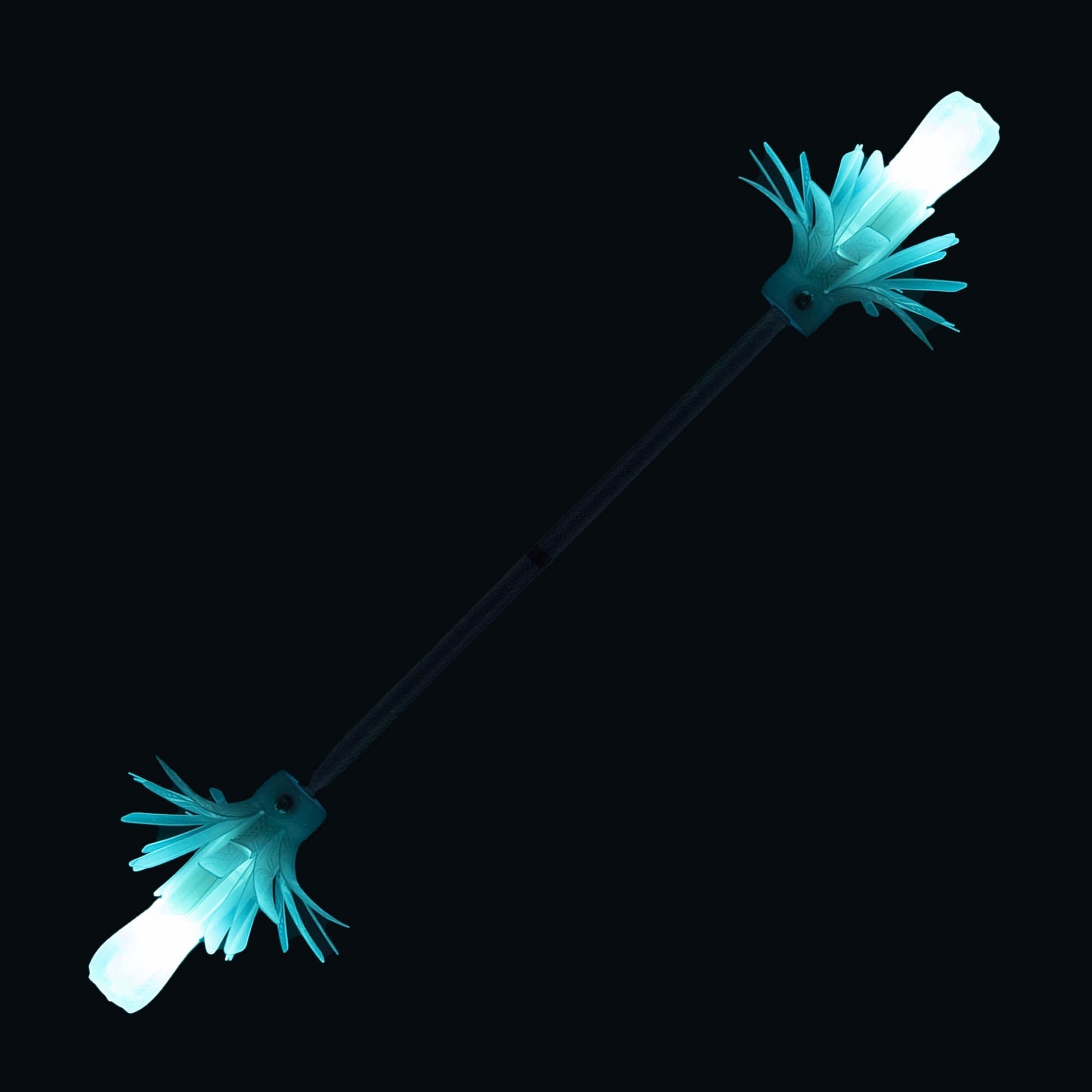 Flowtoys Composite LED Glow Flower Stick V2 glowing with a drak background
