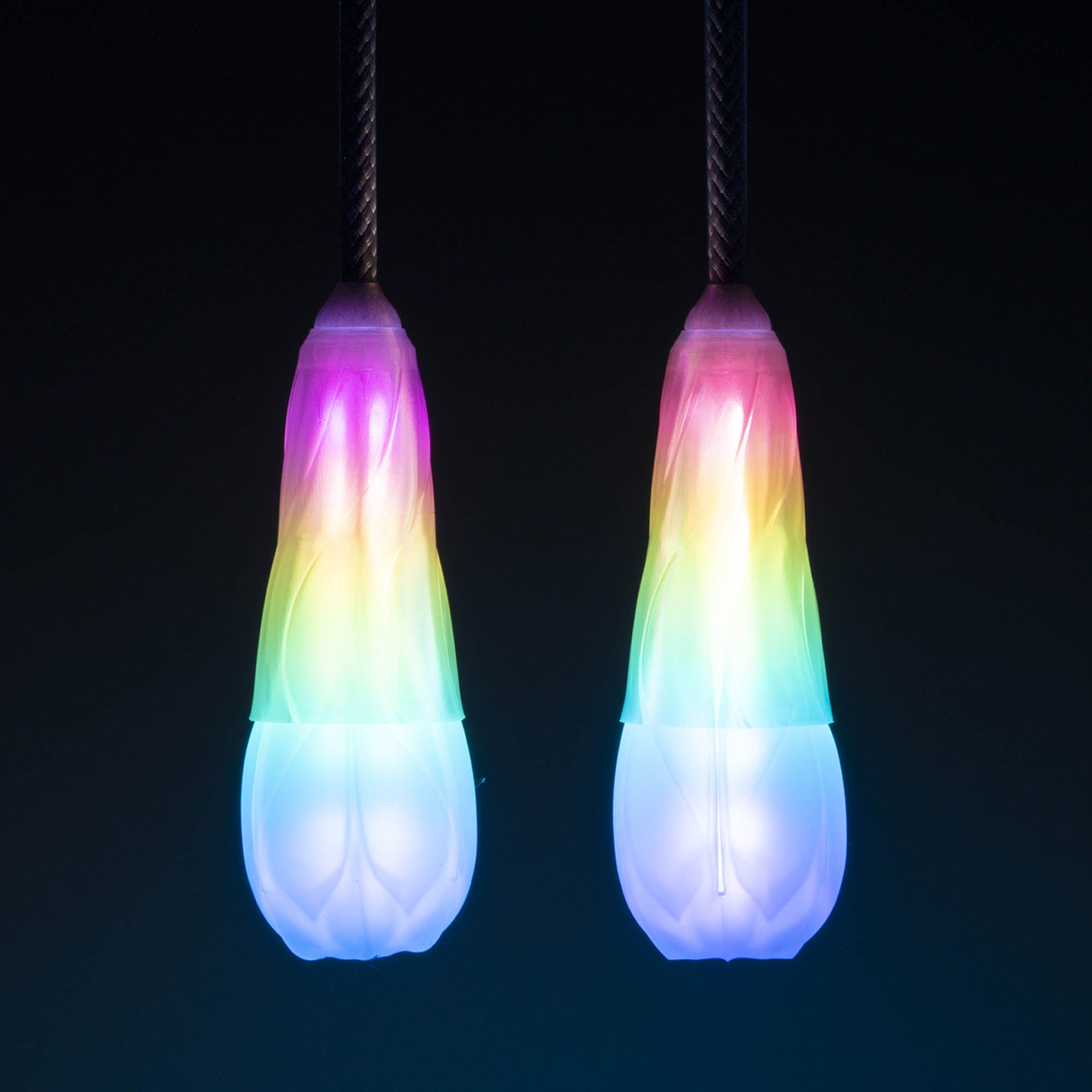 Flowtoys vision spin poi glowing with white background whilst hanging