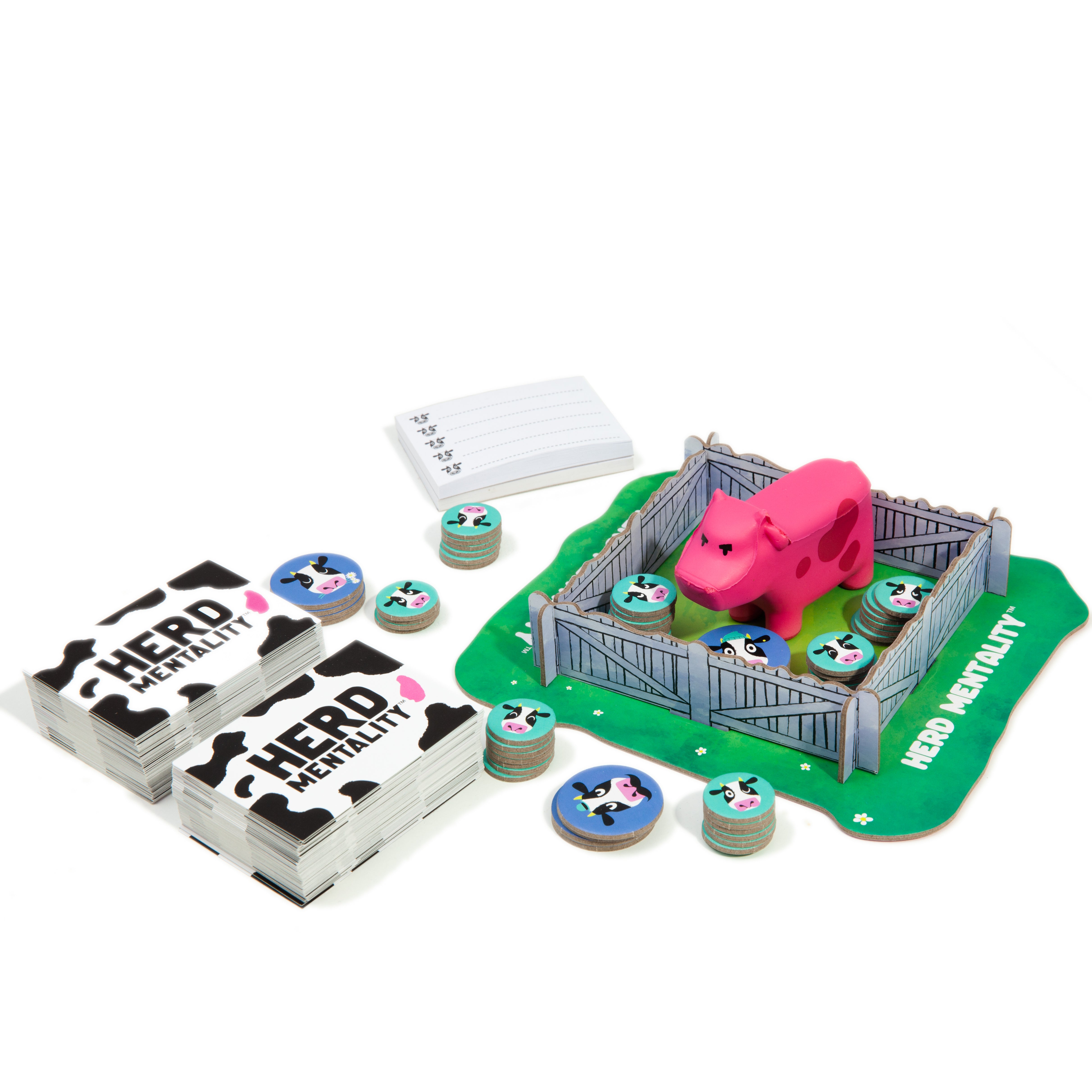 Board game set with pink cow figure, cards, and game board on a white background