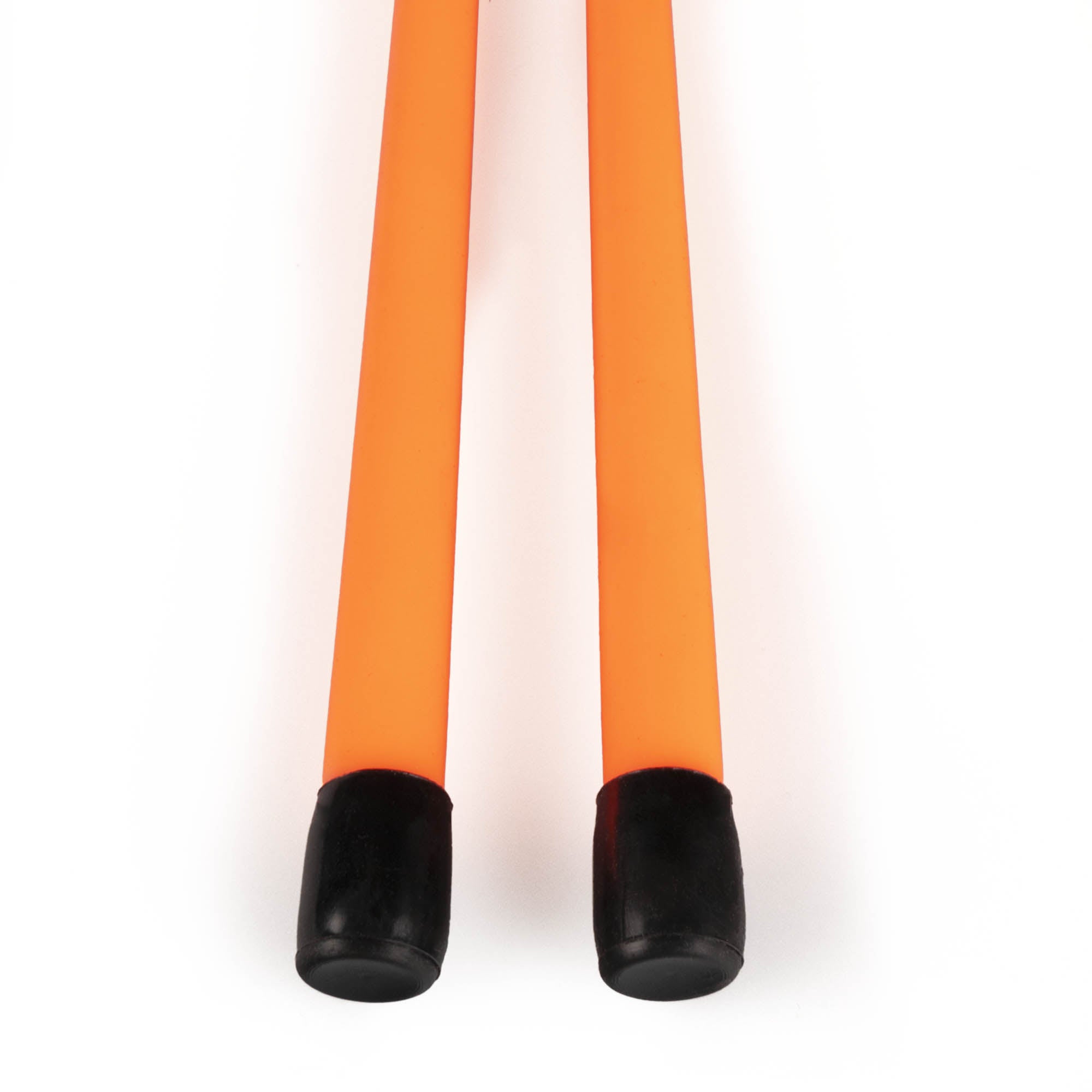 Close up of black caps at the end of orange devil sticks